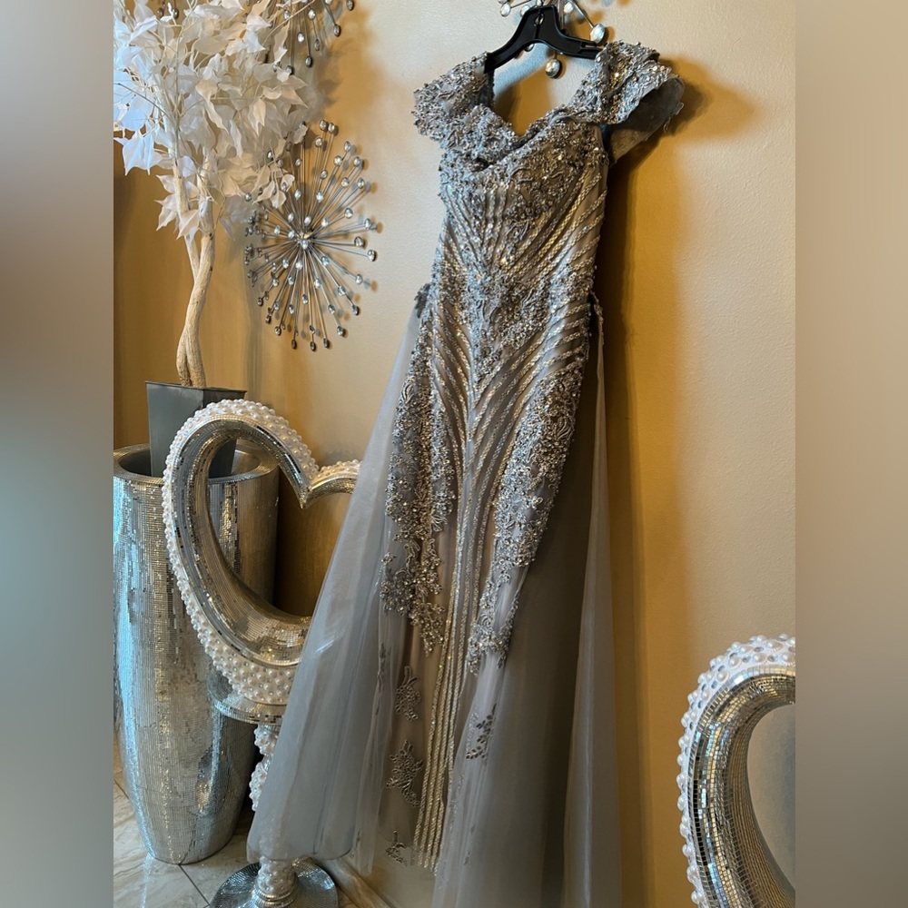 Dress is beautiful. I only wear it one time. It has a big rhinestones,